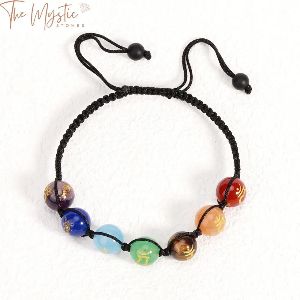 A handmade braided bracelet featuring an array of 10mm natural stone beads, each representing the 7 chakras.