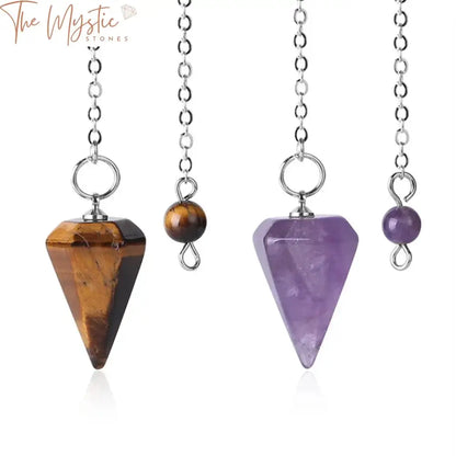 A collection of small Reiki healing pendulums, crafted from natural stones, elegantly displayed.