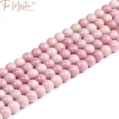 A close-up image of natural Rhodochrosite stone beads in varying sizes of 4mm, 6mm, 8mm, and 10mm.