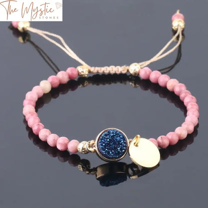 A delicate 4mm line bracelet featuring natural rhodonite stones woven together, with a gold-colored tag.