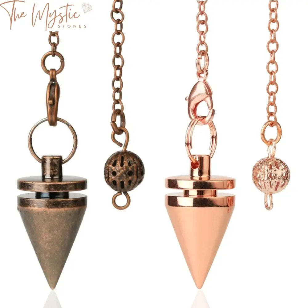 A small, cone-shaped metal pendulum with a smooth surface and a rose gold hue hangs from a delicate copper chain.