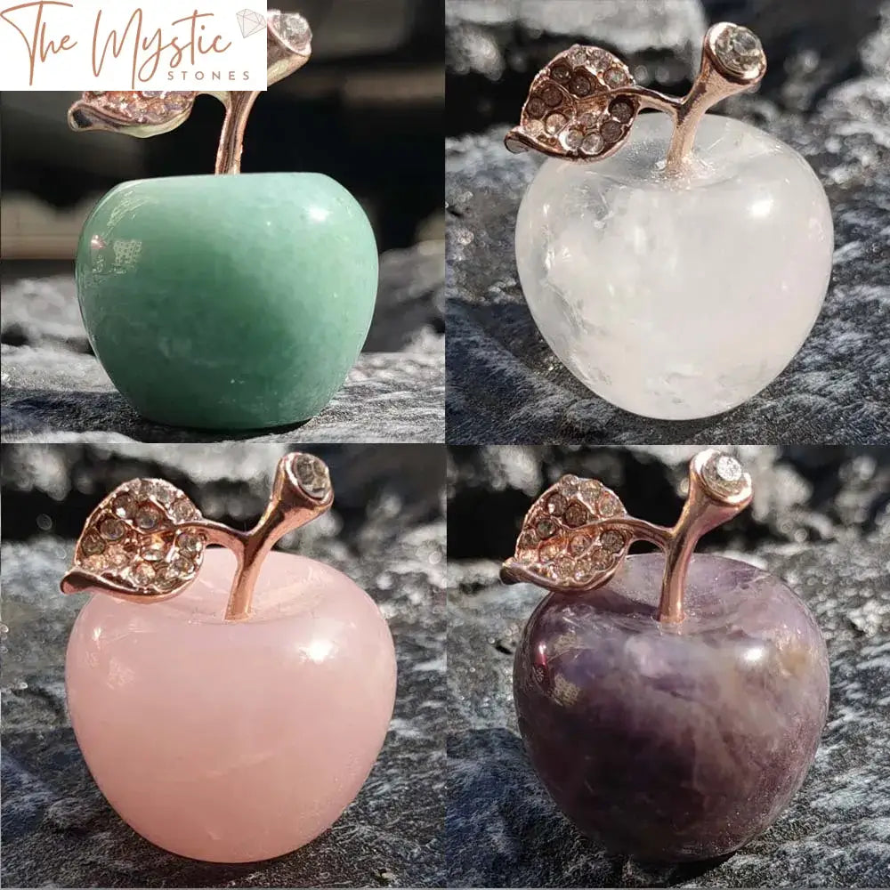 A 1.5-inch natural rose quartz crystal apple paperweight with a smooth, polished surface and a delicate pink hue.