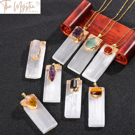 A rectangular pendant featuring an inlaid design with raw selenite, amethyst, and citrine crystals.