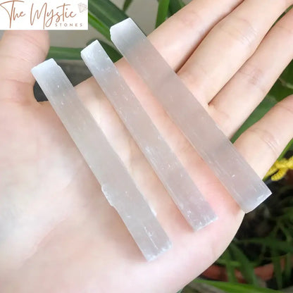 A collection of various-sized natural Selenite crystal sticks, each approximately 7-9 cm in length.