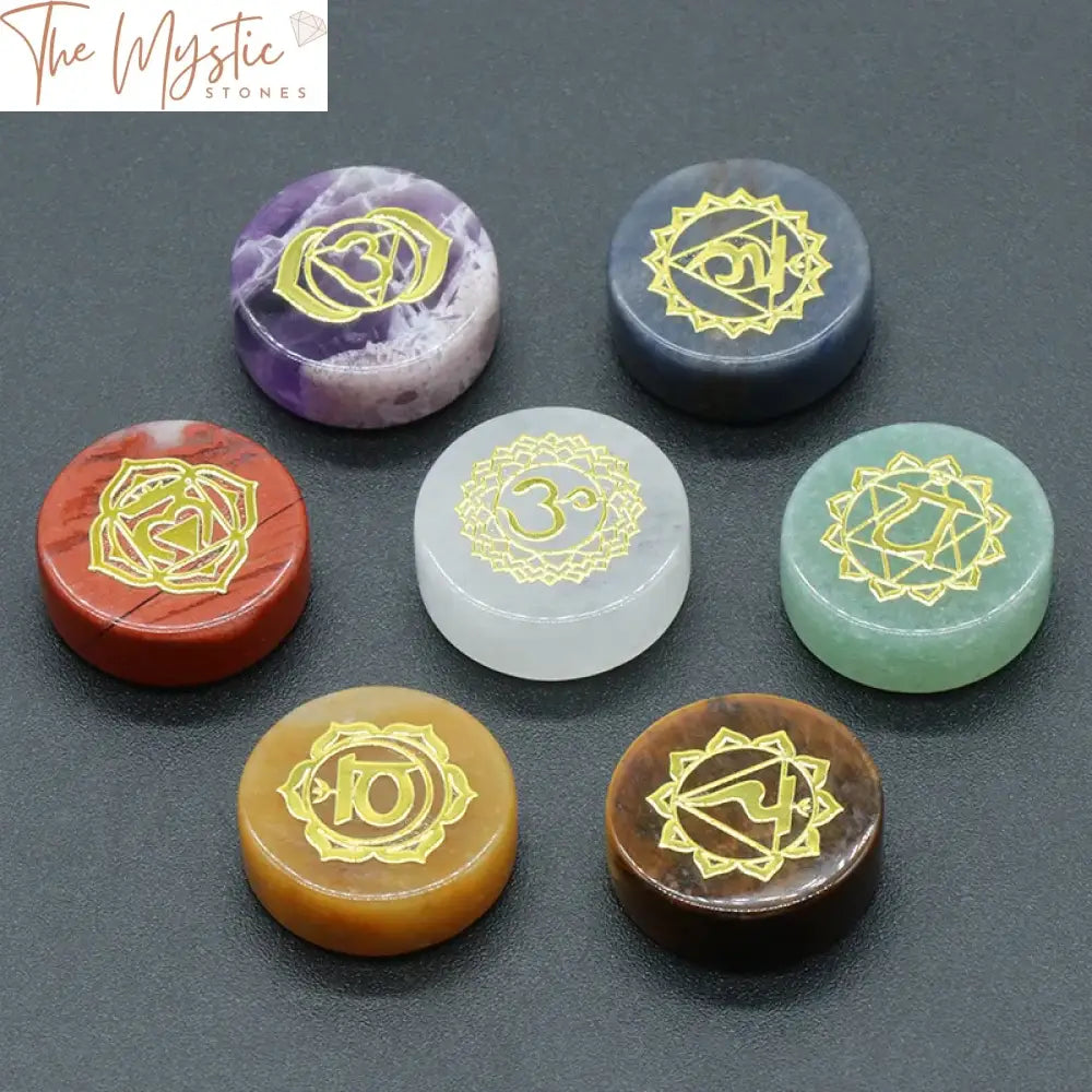 A set of seven colorful round gemstones, each engraved with a unique chakra symbol.