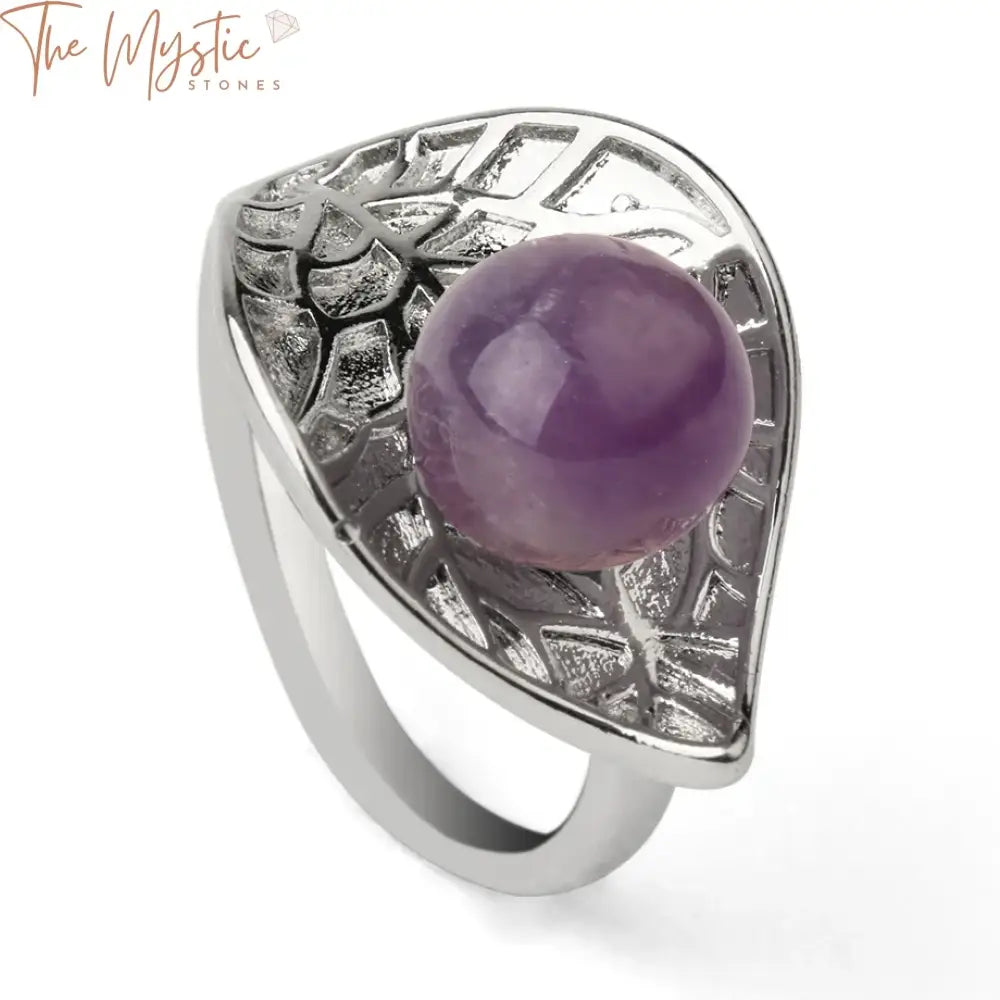 A close-up image of a silver adjustable ring for women featuring a natural crystal stone as its centerpiece.