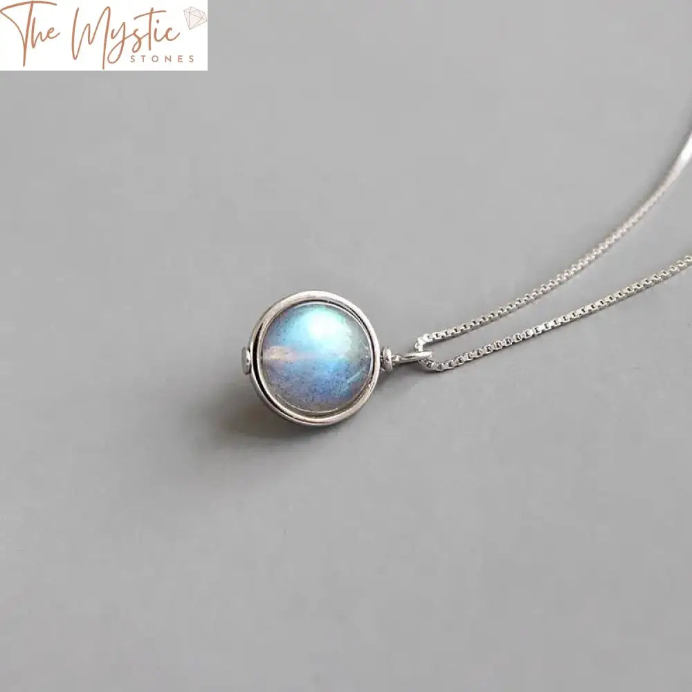 A silver box chain necklace featuring a round-shaped moonstone pendant.