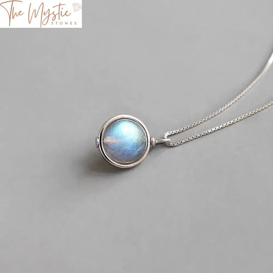 A silver box chain necklace featuring a round-shaped moonstone pendant.