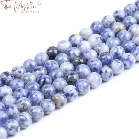 A collection of sodalite beads in various sizes (4, 6, 8, 10mm) featuring deep blue tones with striking white spots.