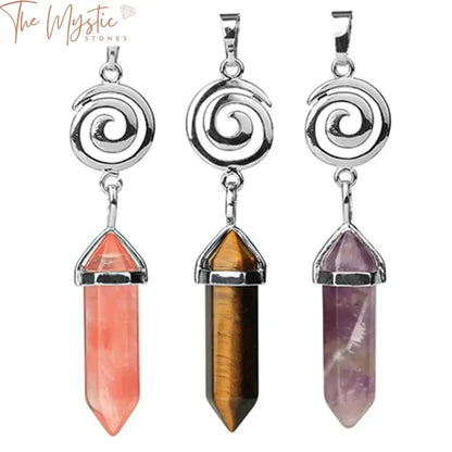 A collection of spiral hexagonal crystal pendants displayed on a neutral background.