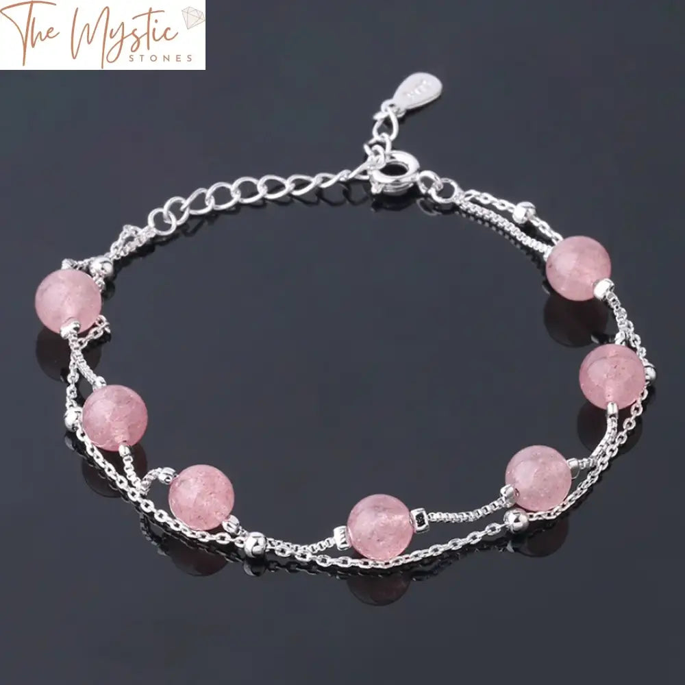 A delicate bracelet featuring 6mm round pink strawberry crystal beads linked together.