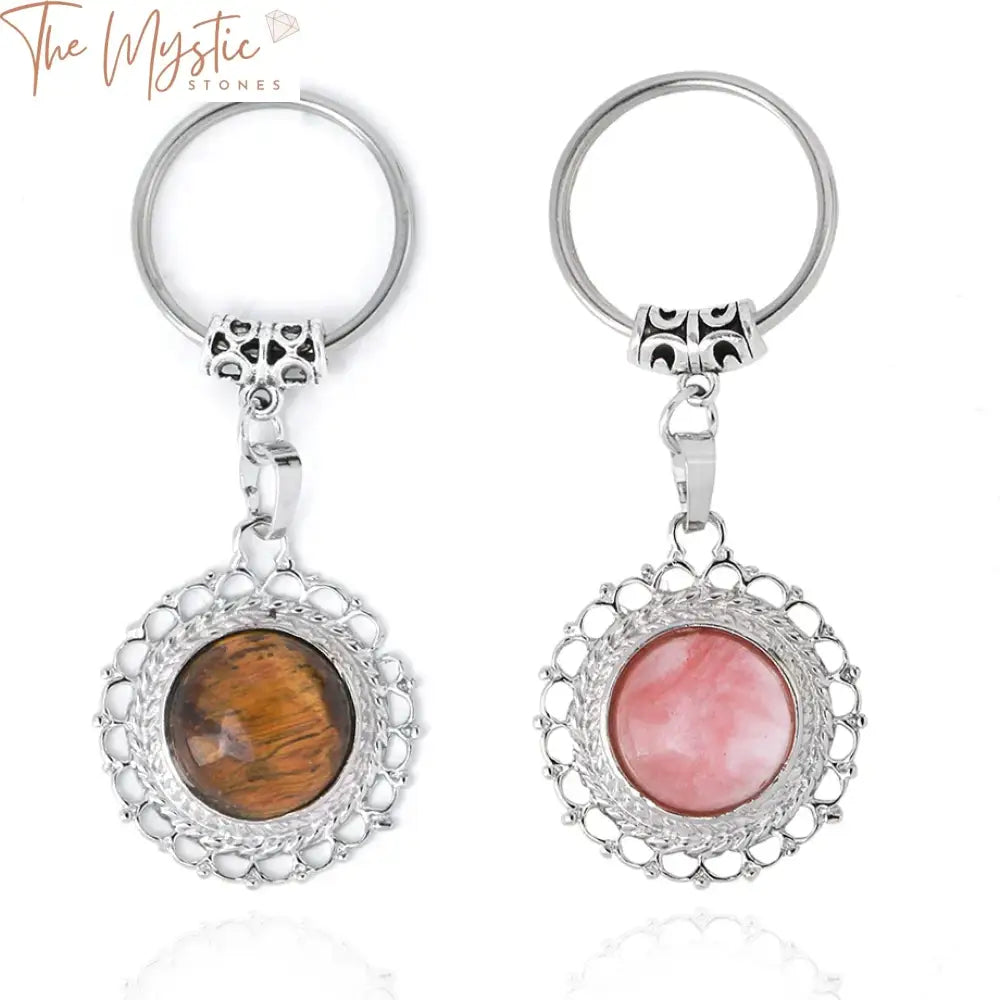 A collection of natural stone crystal keychains displayed on a light background.