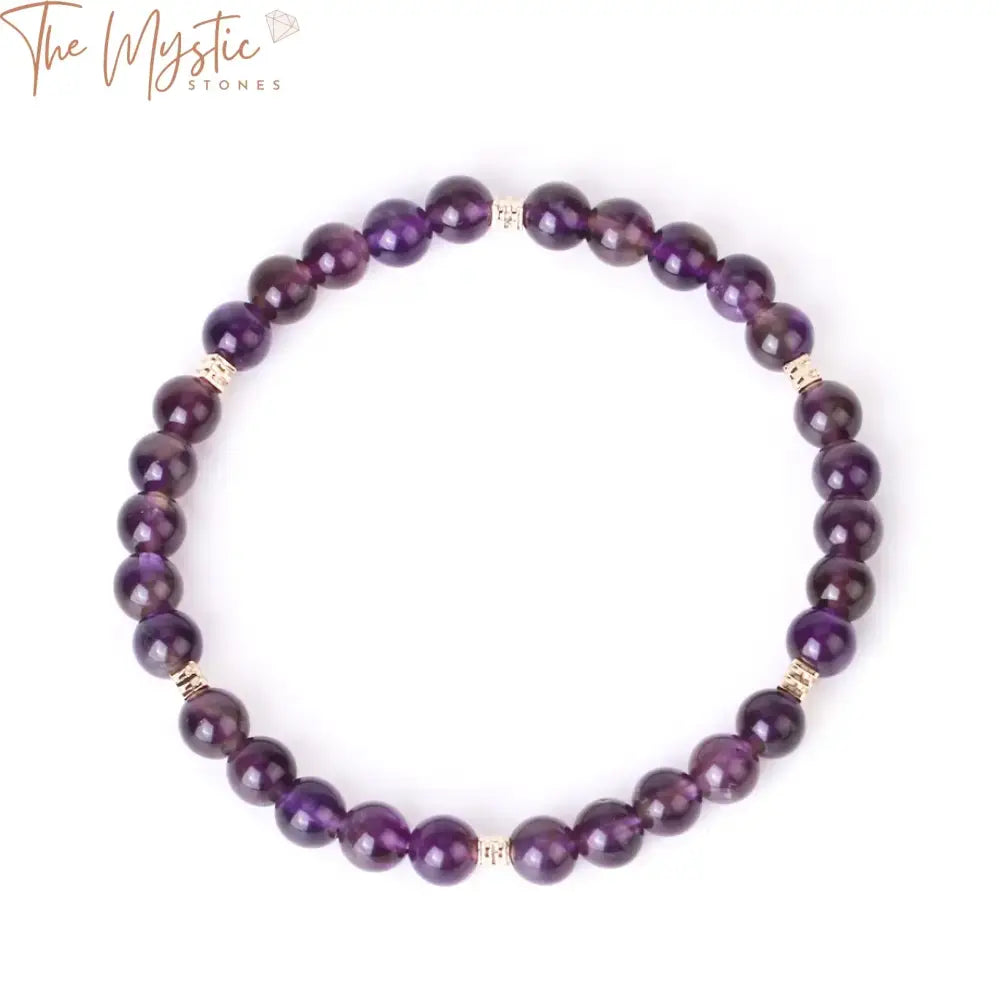 A bracelet made of 6mm crystal beads featuring natural sun stone and amethysts.