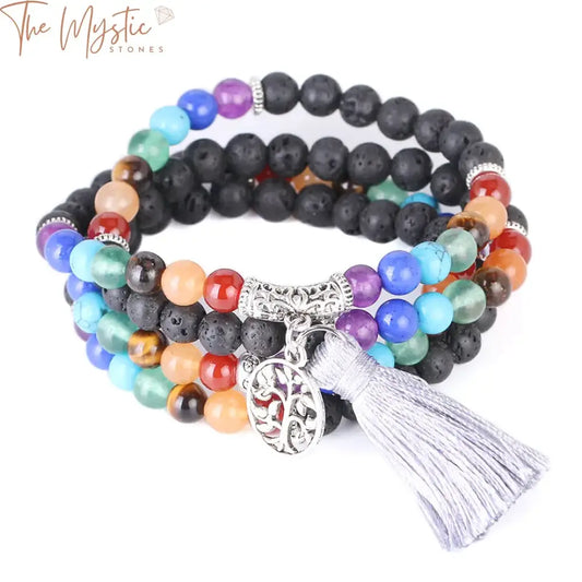 A collection of multilayered men's bracelets featuring natural black lava rock beads.