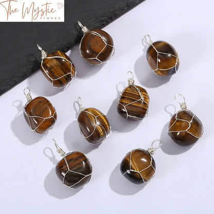 A beautifully crafted pendant featuring an irregularly shaped natural Tiger Eye stone, wrapped with elegant silver wire.