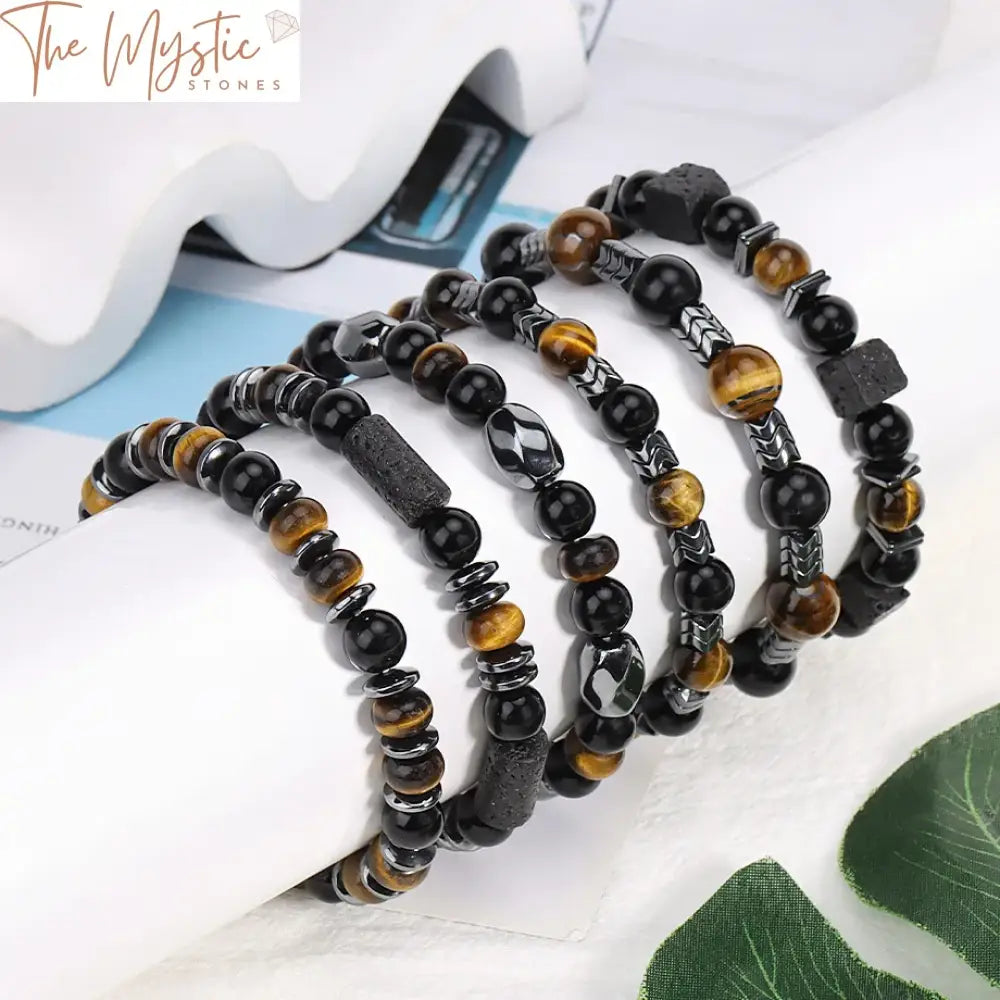 A stylish bracelet made of polished natural tiger eye and hematite beads, alternating in pattern.