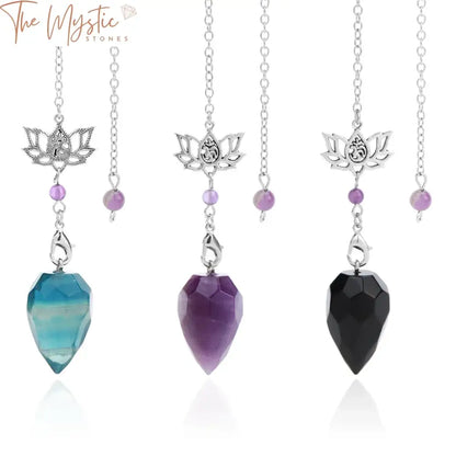 A collection of seven spiritual crystal pendulums is displayed against a plain background.