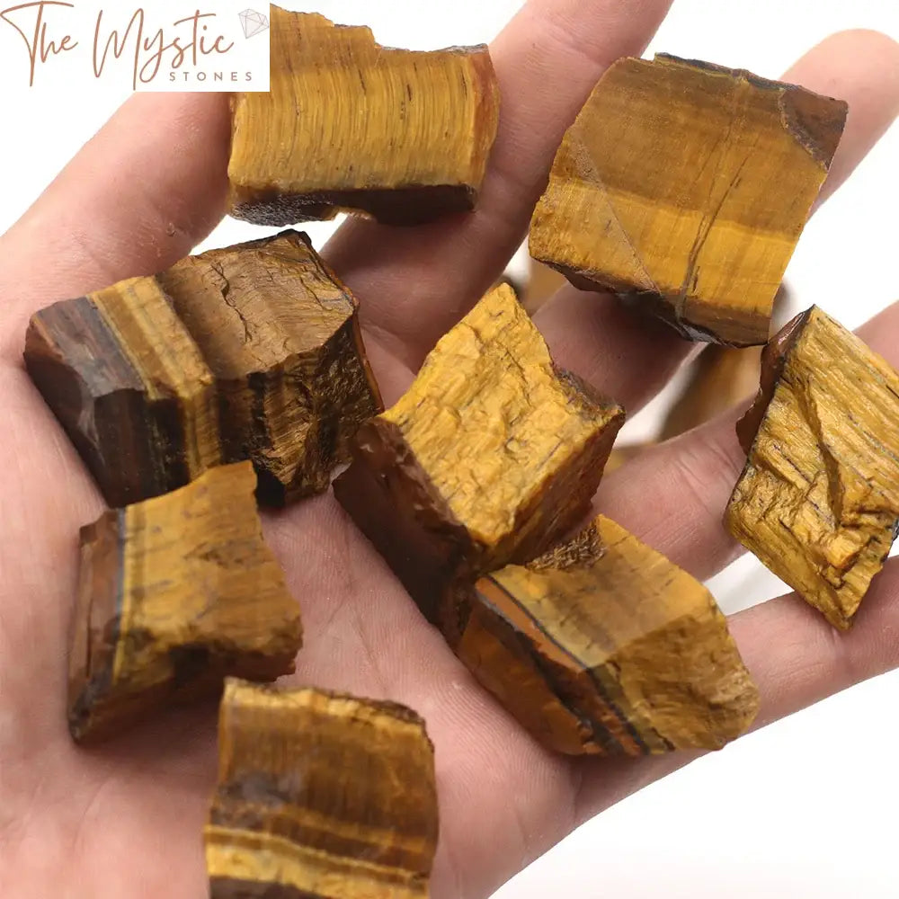 A close-up image of a natural Tiger Eye raw stone featuring its characteristic silky luster and golden to brown bands.