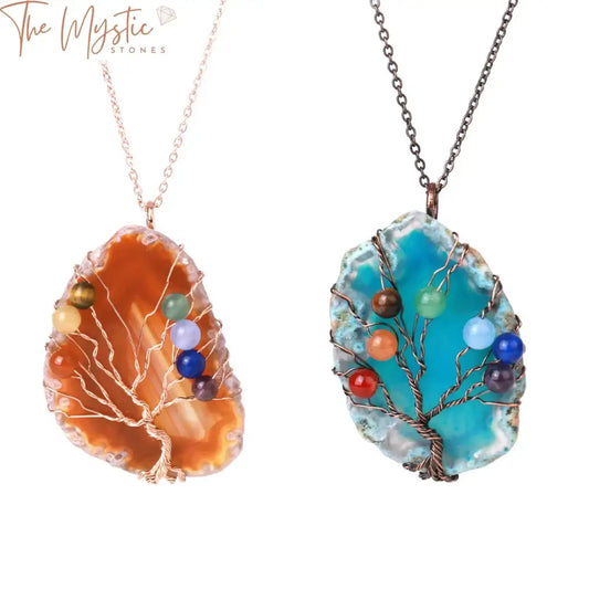 A beautifully crafted Reik Tree of Life necklace pendant featuring irregularly shaped agate crystals.