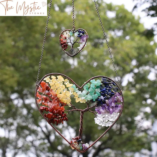 A decorative hanging featuring a double love heart design wrapped in copper wire, adorned with natural crystal gravel stones.