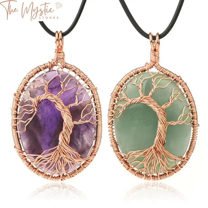 A pendant necklace featuring an egg-shaped, polished natural stone cabochon wrapped in wire to form a Tree of Life design.