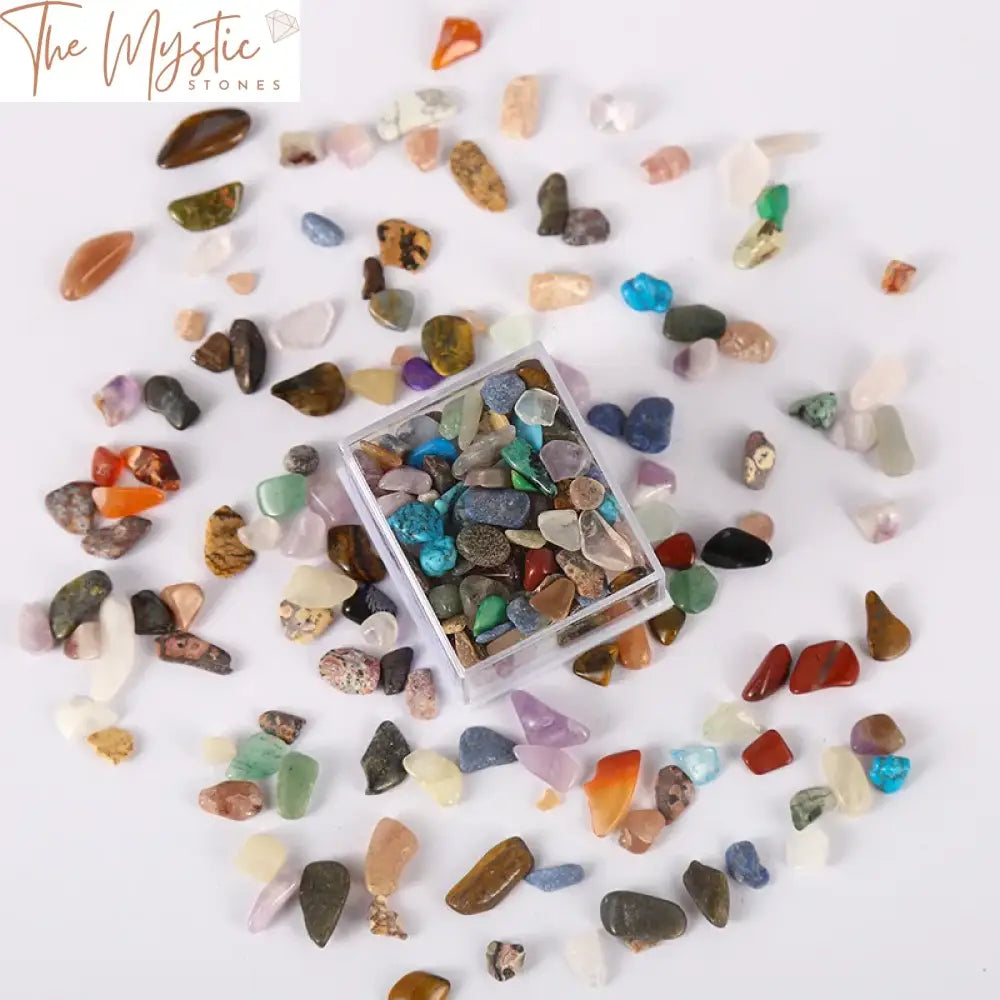 A variety of tumbled stone chips in assorted colors and shapes, displayed in a mini box.