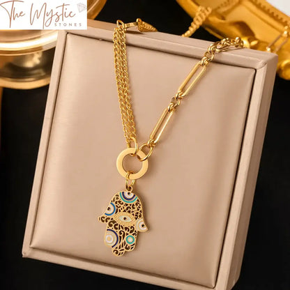 A luxurious stainless steel chain necklace in a radiant gold color, featuring a Turkish Hamsa Fatima hand pendant.