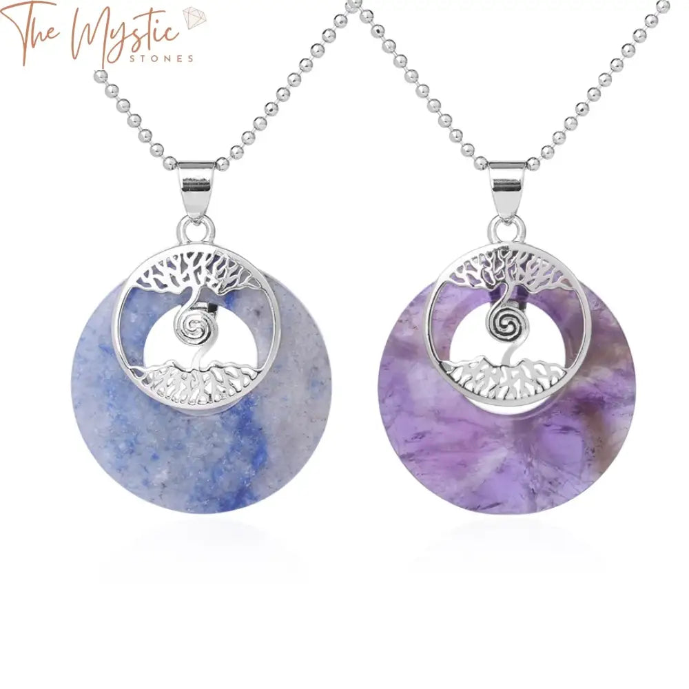 Two tree of life pendant necklaces are featured, each with a round gemstone.