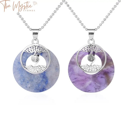 Two tree of life pendant necklaces are featured, each with a round gemstone.