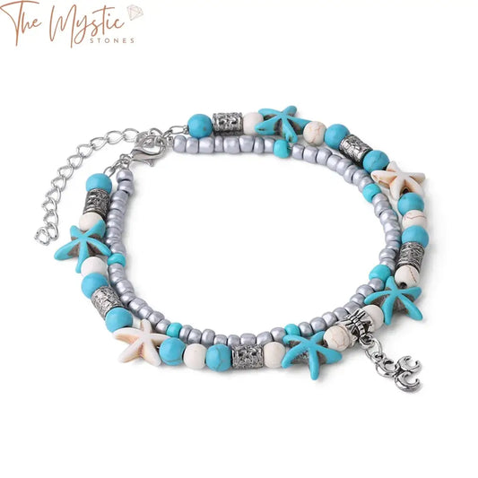 A double-layer anklet featuring vintage shell elements, starfish charms, and a tiny moon pendant.