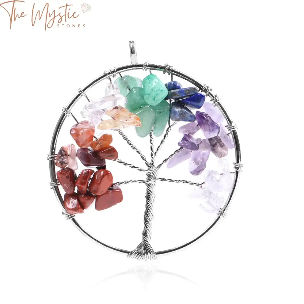 A close-up image of a handmade pendant featuring a Life Tree design, crafted with natural gemstone chips in various colors.