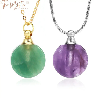 A crystal bottle perfume necklace featuring a round natural stone pendant suspended from a stainless steel chain.